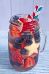 Cocktail with strawberry, blueberry and apple