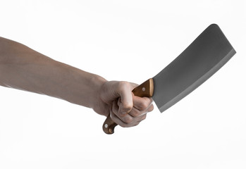 Hand holding a knife for meat, chef holding a kitchen knife