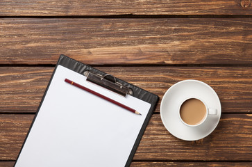 Cup of coffee latte and business tablet