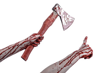 bloody hand holding a bloody butcher's ax isolated in studio