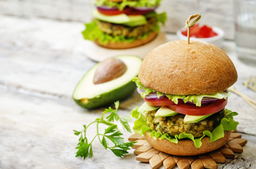 spicy vegan curry burgers with millet, chickpeas and herbs