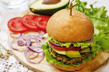 spicy vegan curry burgers with millet, chickpeas and herbs