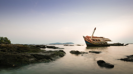 An old fishing boat wreck near the coast.