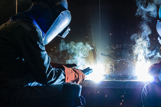 Welding work during night time with friends