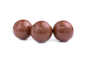 Chocolate candies on a white background.