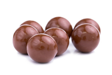 Chocolate candies on a white background.