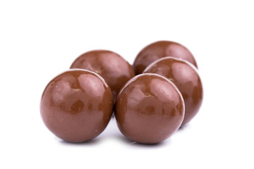 Chocolate candies on a white background.