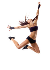 Fototapeta na wymiar Stylish and young modern style dancer jumping