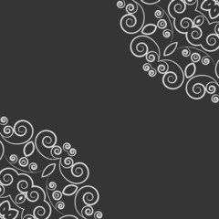 Black background with white ornate pattern
