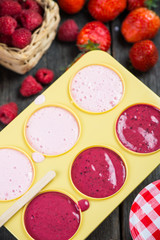 making homemade summer fruit lolly pops