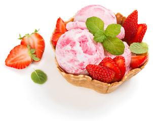Scoops of strawberry ice cream in a wafer bowl