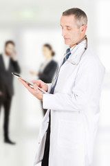 Doctor with tablet.