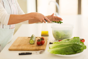 woman making vegetable salad