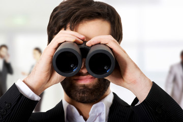 Fototapeta na wymiar Businessman using binoculars.