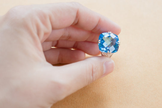 Hand on gem stone jewellery ring