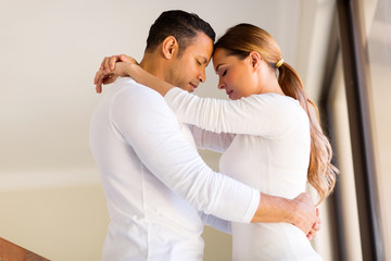 couple hugging with eyes closed