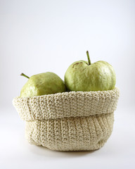 Green guava fruit  in a sack
