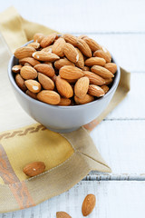 Fresh almonds in a ceramic bowl