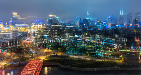 Fototapeta na wymiar Blurred city lights and office buildings