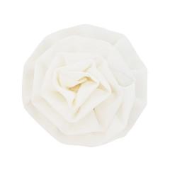 white fabric blossom rose on white background, top view