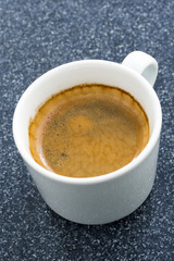 cup of coffee on a dark background, vertical