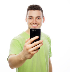 young man making photo of himself