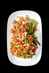 Fried chicken skin served on white dish