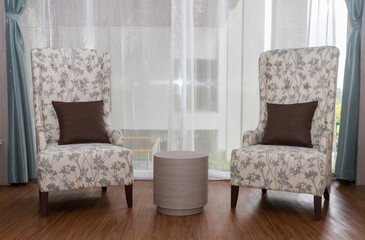 Two modeern chairs in livingroom.