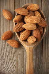 Almonds in wooden spoon