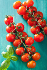cherry tomatoes over turquoise background