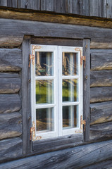 Rustic cottage window in old wooden rural house