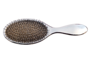 Close-up of an used hairbrush viewed from above, isolated - obrazy, fototapety, plakaty