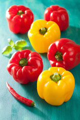 healthy vegetable red yellow peppers on turquoise background