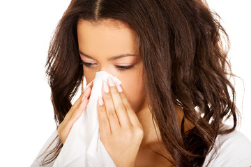 Young african woman using a tissue.