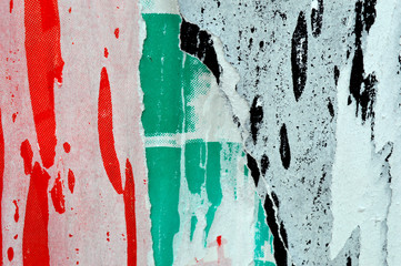 a textured background image of torn layers of posters