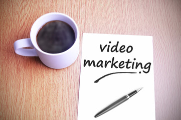 Coffee on the table with note writing video marketing
