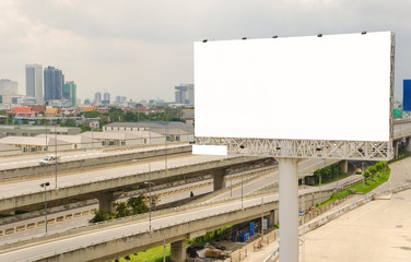 large blank billboard on road with city view background