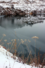 Winter landscape of trees and river with snow