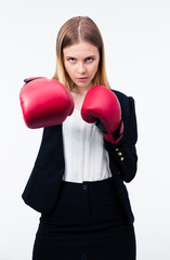 Portrait of a businesswoman in boxing gloves