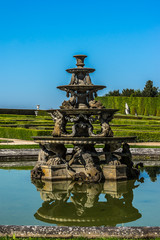Fountain in beautiful gardens of famous Versailles palace.