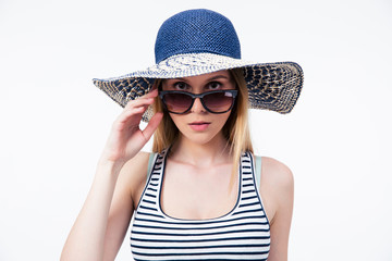 Trendy young woman in hat and sunglasses 