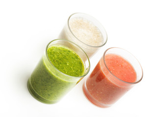 Glasses with smoothies isolated on white background