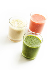 Glasses with smoothies isolated on white background