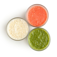 Glasses with herbs, strawberry and banana smoothies