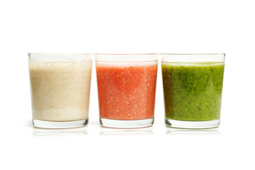 Glasses with herbs, strawberry and banana smoothies