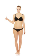 Woman in bikini with thumbs up.