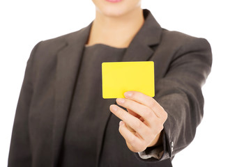 Businesswoman holding blank card.