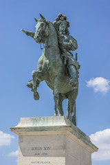 Fototapeta na wymiar Monument by Louis XIV in front of Versailles Palace. Paris.