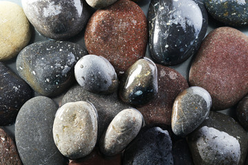 Wet sea pebbles background
