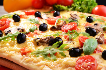 Delicious homemade pizza on table close-up